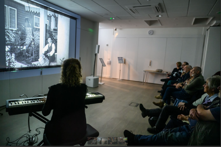 PFF Audience with Meg Morley playing piano, photo by Katja Ogrin
