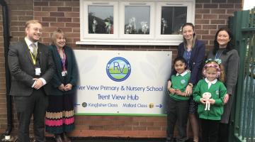 Alex Hunt with staff and pupils